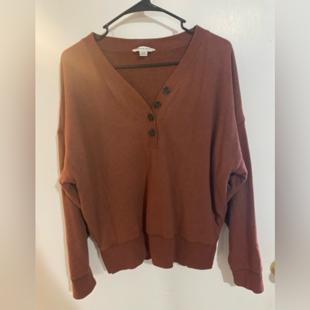 Rust colored lose fitting long sleeve sweater